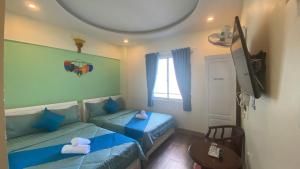 TV a/nebo společenská místnost v ubytování HUY HOANG II Hotel - Da Lat