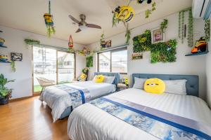 Postel nebo postele na pokoji v ubytování Yokkaichi Guest House + 37 fotografií