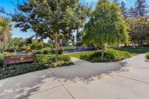 a sign at the entrance to a park with trees at 495 - Upscale Home with AC and Patio near Meta and Stanford in Menlo Park +5 photos