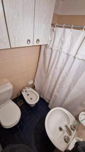 a small bathroom with a toilet and a sink at San Bernardo in San Bernardo +11 photos