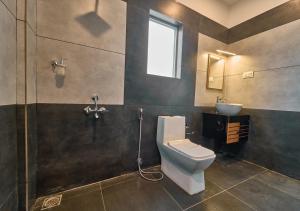 Koupelna v ubytování Irish County Vagamon Pool Resort by VOYE HOMES