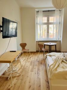 Televízia a/alebo spoločenská miestnosť v ubytovaní Central City Retreat