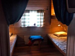 Postel nebo postele na pokoji v ubytování Fjällhalsen Cottages