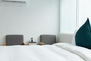 Postel nebo postele na pokoji v ubytování 森浩文旅