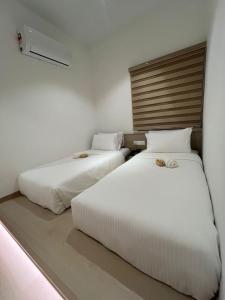Postel nebo postele na pokoji v ubytování SWM Hotel