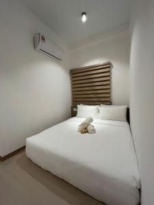 Postel nebo postele na pokoji v ubytování SWM Hotel