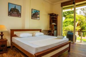 Postel nebo postele na pokoji v ubytování The Quale Villa
