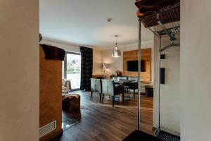 A television and/or entertainment centre at Residenz JANET by MoniCare