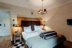 A bed or beds in a room at Residenz JANET by MoniCare