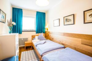 A bed or beds in a room at Haus Cervelli by MoniCare