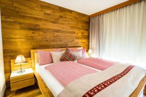 A bed or beds in a room at Haus Cervelli by MoniCare