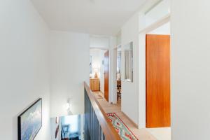 a hallway of a house with a staircase and a door at Haus MARGOT by MoniCare in Seefeld in Tirol