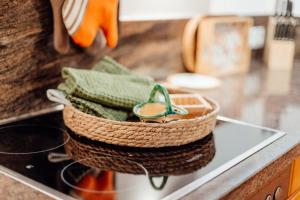 a basket with a pair of shoes sitting on a counter at Haus MARGOT by MoniCare in Seefeld in Tirol +26 photos