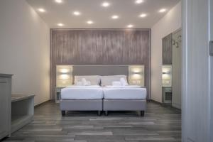 Postel nebo postele na pokoji v ubytování Hotel Villa Paradiso Suite
