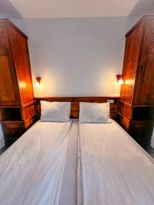 Postel nebo postele na pokoji v ubytování Banderitsa Hotel