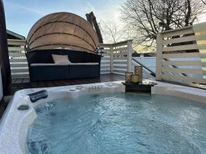 a hot tub with a boat on a deck at Best XL Home To Visit NYC+Hot Tub+Newark Airport+Free Parking in Hillside