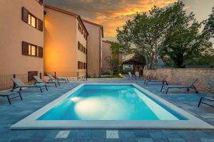 La pileta dentro o cerca de Apartments Cesare with Shared Pool