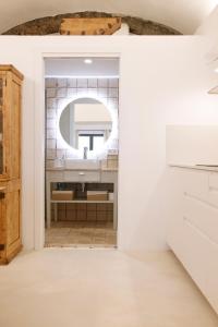 a bathroom with a mirror and a sink at Maram Brava casa centro Begur Metge Pi in Begur