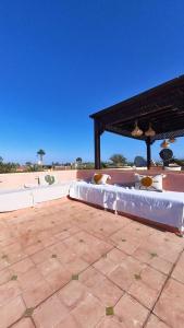 a bed on a patio next to a skate park at Villa Belle vue - with a private & Heated pool in Marrakesh