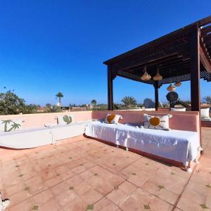 a bed on a patio next to a skate park at Villa Belle vue - with a private & Heated pool in Marrakesh