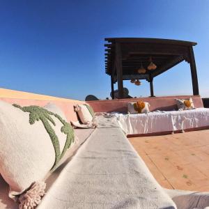 a bed with pillows sitting on top of a building at Villa Belle vue - with a private & Heated pool in Marrakesh +40 photos