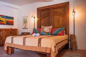 Giường trong phòng chung tại La Perla del Caribe - Villa Topaz