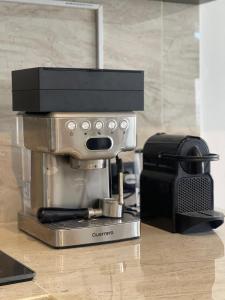 a coffee maker sitting on top of a counter at New 2BR Villa Private Pool Near Seminyak in Kerobokan