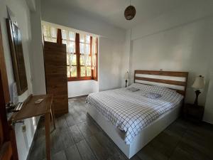 Postel nebo postele na pokoji v ubytování Kuyu Beergarden Hostel