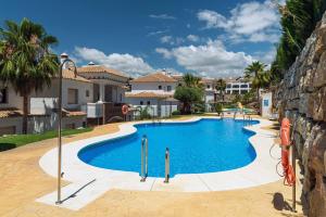 a large swimming pool in a villa at Albatros in Casares