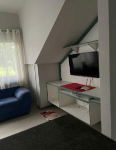 TV a/nebo společenská místnost v ubytování Villa do Rainer