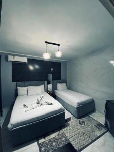 Voodi või voodid majutusasutuse NADA - HOTEl toas