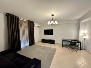 TV a/nebo společenská místnost v ubytování REM Apartments + 5 fotografií