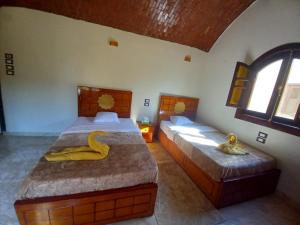 Postel nebo postele na pokoji v ubytování Nubian Soul Guest Houses