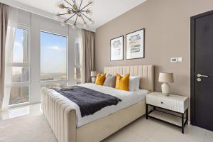 Postel nebo postele na pokoji v ubytování Silkhaus Classic 2BR at Horizon Tower in Reem Island