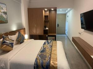 Postel nebo postele na pokoji v ubytování M9 Kirirom Hotel