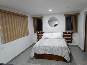 Postel nebo postele na pokoji v ubytování ocsoasis