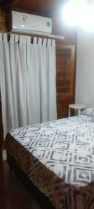 Giường trong phòng chung tại Deptos Los Troncos +7 ảnh