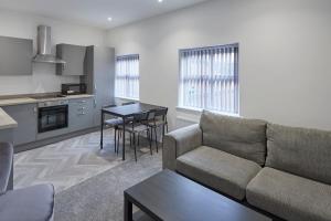 a living room with a couch and a table at Zetland House Apt 4 in Loftus +17 photos
