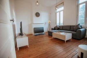 Un televizor și/sau centru de divertisment la Grand appartement en centre ville