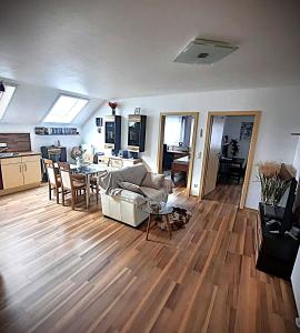 a living room with a couch and a table at Pension Talhaus-WG Allmersbach in Allmersbach im Tal