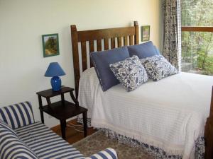 En eller flere senge i et værelse på Casa Pala Luar