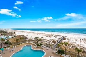 a view of the beach from the balcony of a resort at Emerald Isle unit 406 in Pensacola Beach