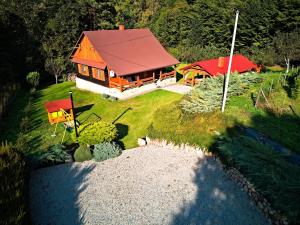 an overhead view of a house with a red roof at Agroturystyka - AGRODOMEK -Basen, Jacuzzi, Sauna in Nozdrzec