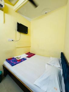 Postel nebo postele na pokoji v ubytování RR Guest House