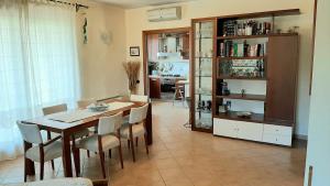 a dining room with a table and chairs at Casa Daniela in Sarroch