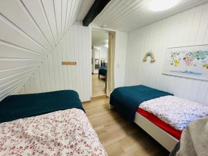 a bedroom with two beds in a room at Ferienhaus Zorgenfrei in Walkenried