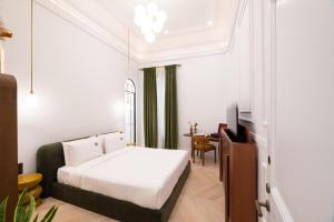 Postel nebo postele na pokoji v ubytování Emerald Hotel Athens