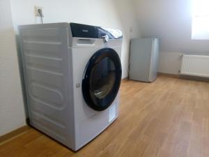 a washing machine is sitting in a room at Wohnung Bäckergasse 4 in Unseburg