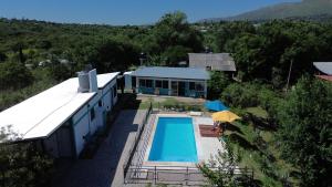 an overhead view of a house with a swimming pool at Las Calandrias in Valle Hermoso