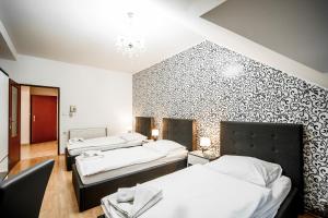 Postel nebo postele na pokoji v ubytování Hotel Panský dům
